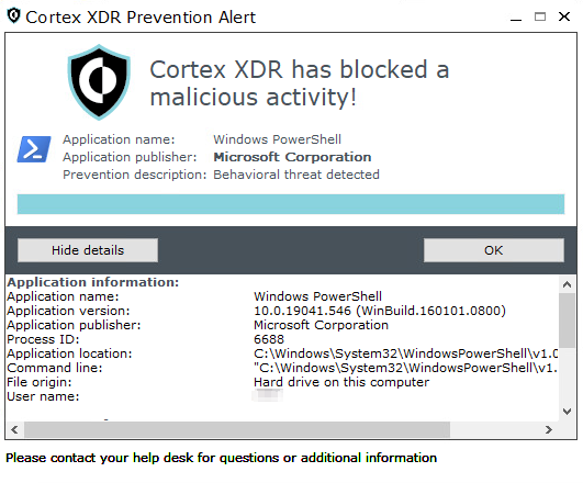 画像 18a は、Cortex XDR Prevention Alert ウィンドウのスクリーンショットです。Cortex XDR has blocked a malicious activity!Application name: Windows PowerShellApplication publisher: Microsoft CorporationPrevention description: Behavioral threat detected[Hide details (詳細を隠す)] ボタンの下には詳細情報が表示されています。その内容は、アプリケーション名、アプリケーションのバージョン、アプリケーションの発行者、プロセス ID、アプリケーションの場所、コマンド ライン、ファイルの生成元、ユーザー名などです。 
