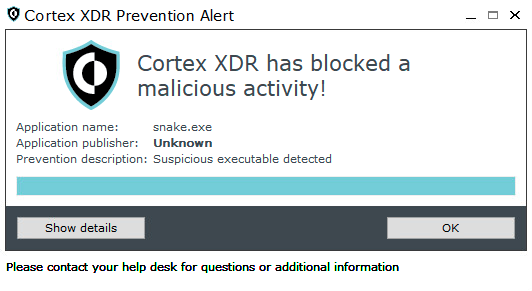 画像 6 は Cortex XDR Prevention Alert ウィンドウのスクリーンショットです。Cortex XDR has blocked a malicious activity!Application name: snake.exe. Application publisher: UnknownPrevention description: Suspicious executable detected[Show (詳細を表示)] と [OK] の 2 つのボタンがあります。 